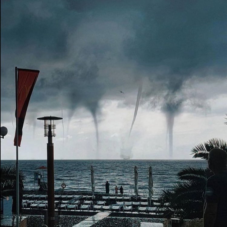 Russia; at Sochi Airport a plane doges multiple tornadoes