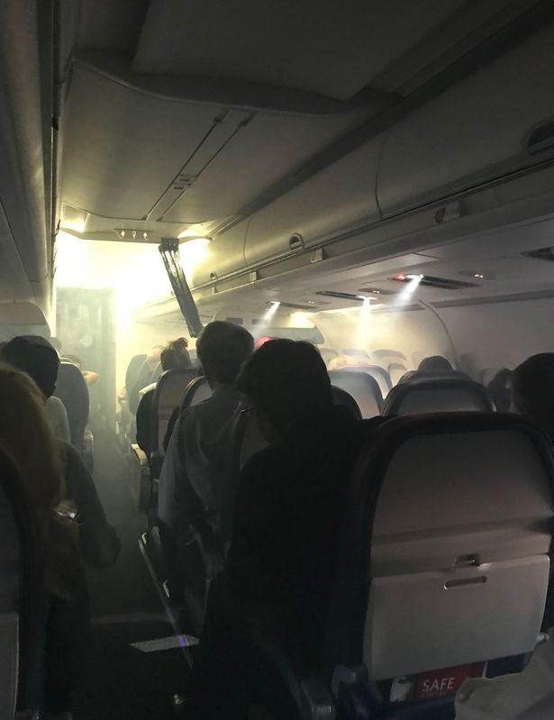 Delta Airlines 'Flight from Hell' passengers forced to climb out through wings after smoke started pouring in the cabin