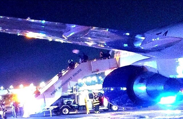 JFK airport rescue services rushed to put fire out on the Delta Airlines Boeing 767's main landing gear