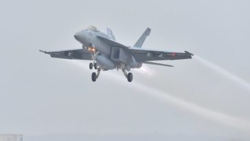 Photos and a video of the U.S. Navy Super Hornets departing Fort Worth for Bush Memorial Flyover under inclement weather