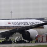 Singapore Airlines; A Boeing 777 catches fire while tow trucks towing it