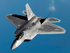  Stealth F-22 Raptor flying with clear blue skies.