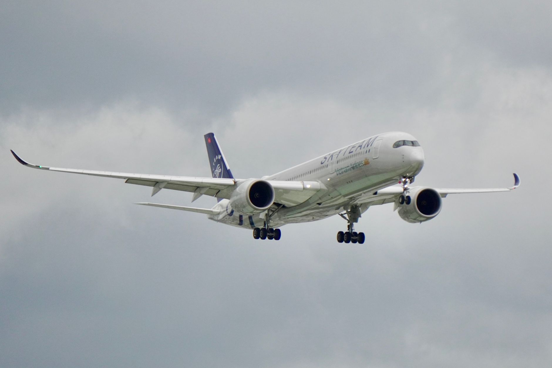 IATA's Summer Travel Forecast and What It Means for Pilot Hiring 2 A group of airline pilots walking through an airport corridor in uniform, representing pilot recruitment and demand