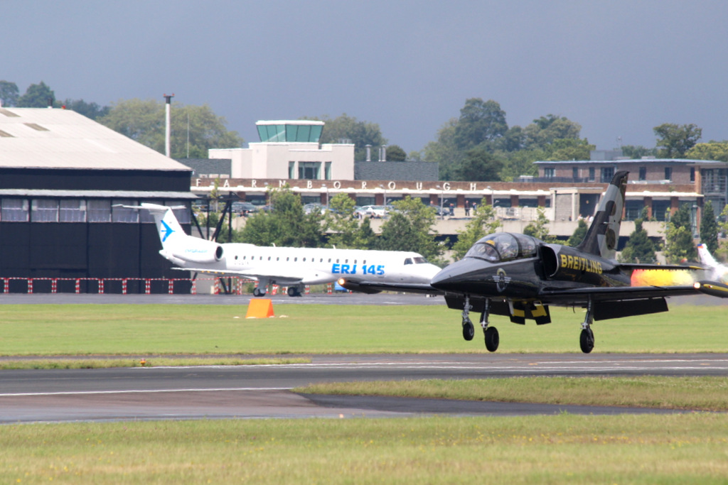 Farnborough Air Show 2026: Highlights and Biggest Deals 3 An eVTOL aircraft on display at a static exhibition area with digital screens showing route maps for urban air mobility services