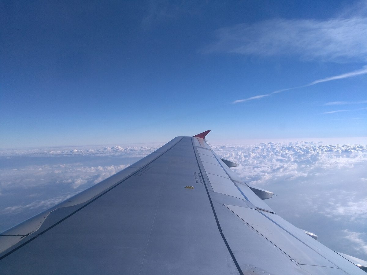Why Plane Cabins Are Always Freezing (and Boiling at the Gate) 6 An airliner wing above the clouds at cruising altitude