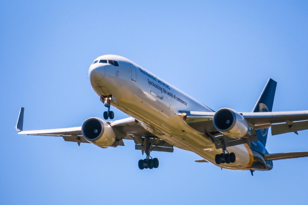 A Boeing 767-300 on final approach with landing gear extended