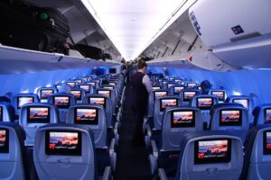 A row of economy seats in an airliner cabin