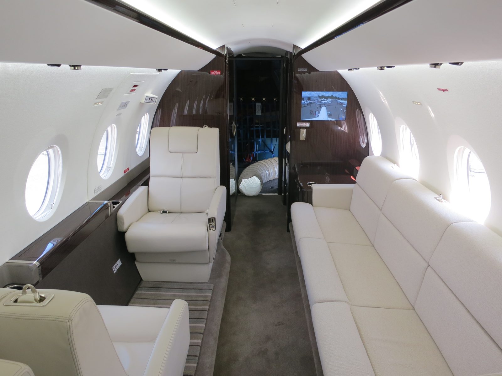How Does Private Jet Charter Work? The Process Explained 3 The cabin of a Gulfstream G280 with divan seating