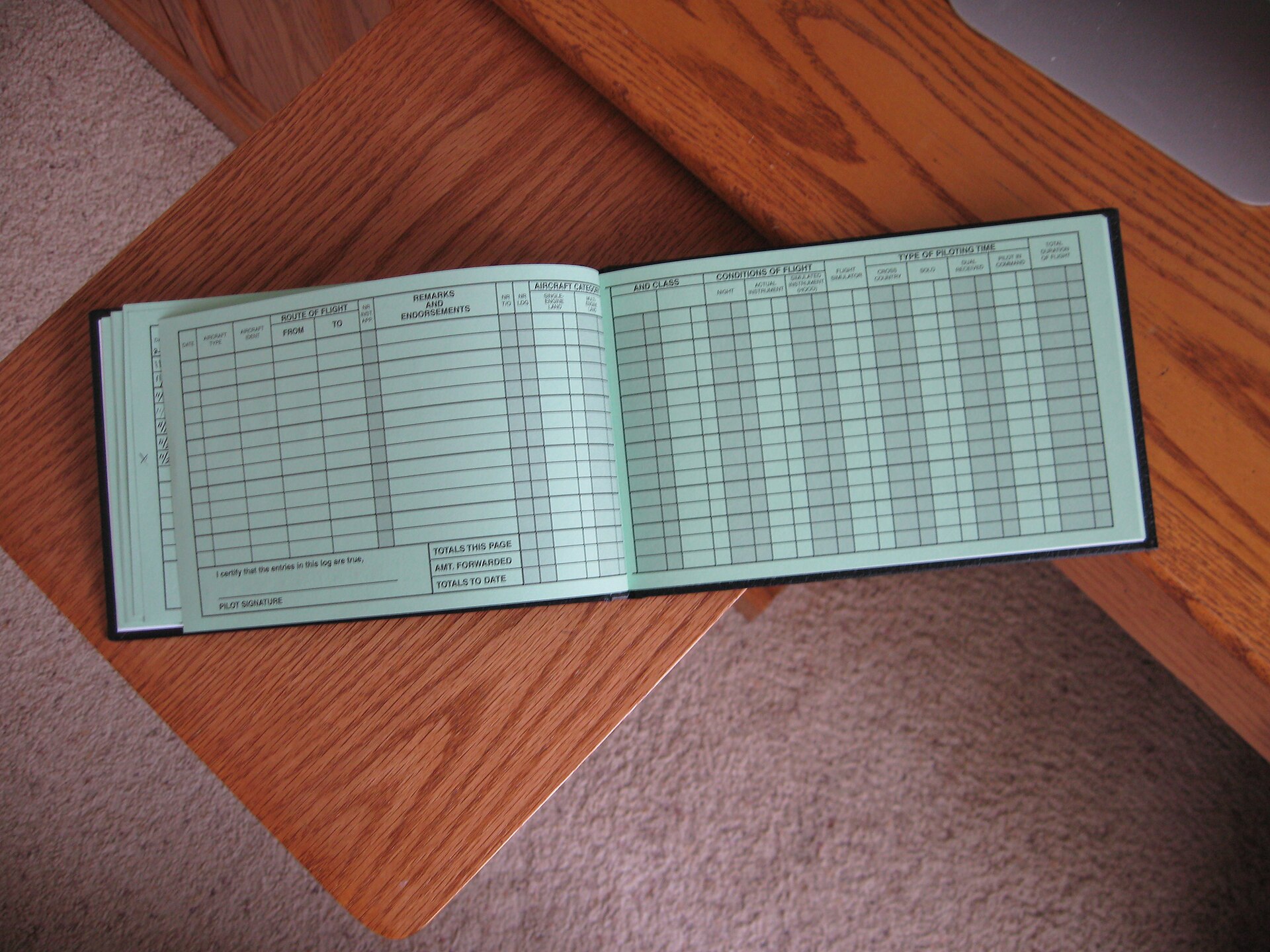 Does a Student Pilot Certificate Expire? What It Lets You Do 2 Open pages of a pilot logbook showing flight entries