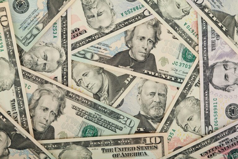 Pilot Salary: How Much Do Pilots Really Make in 2026? Spread of US dollar banknotes representing airline pilot salary