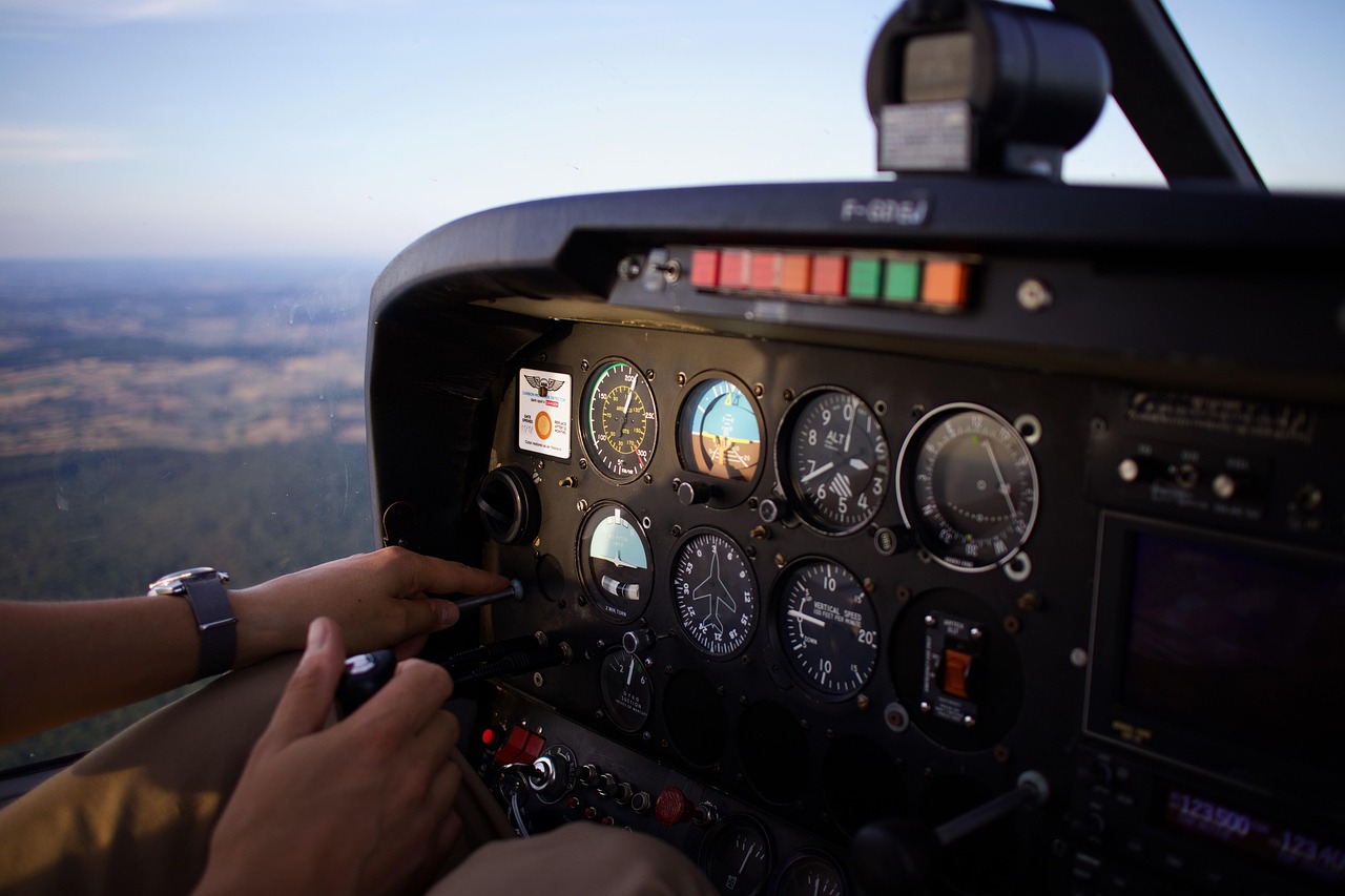 How to Become a Pilot: The Complete Step-by-Step Path (2026) 1 View from the cockpit of a small training aircraft during a student pilot flight lesson