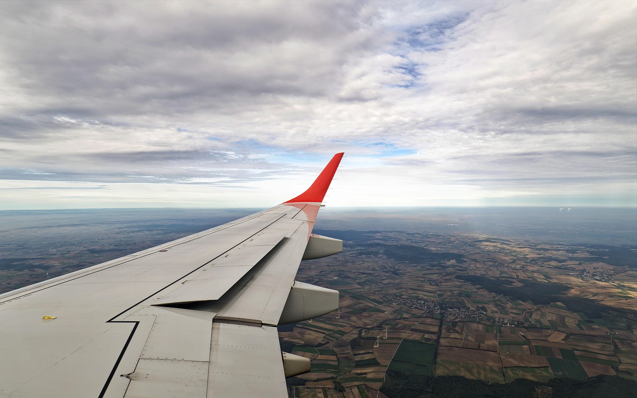 Is Turbulence Really Getting Worse? What the 2026 Data Shows 1 Airplane wing viewed from above the clouds during flight