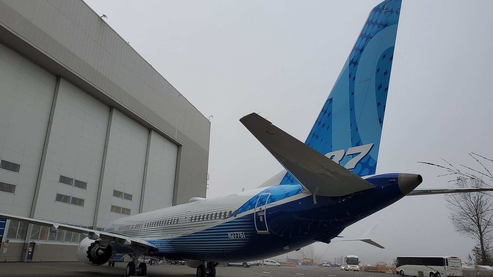 The 737 MAX 10 Is Certified: What the FAA Approved and Who Gets It First 1 The tail and rear fuselage of the 737 MAX 10 prototype beside a factory building at Renton