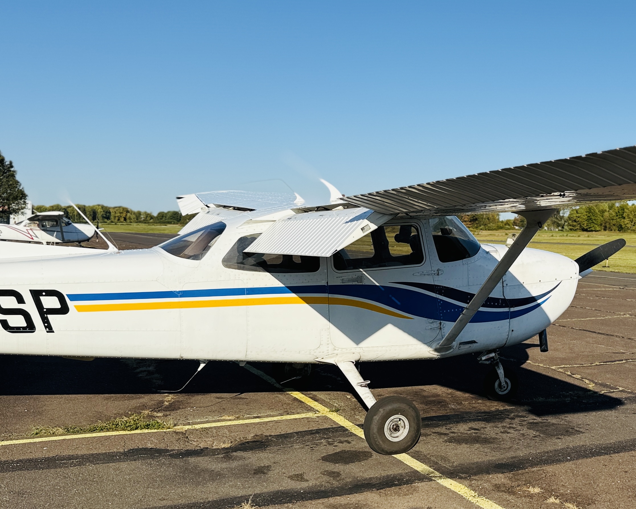 What Aircraft Insurance Actually Costs a Private Owner in 2026 5 A Cessna 172S Skyhawk parked beside a hangar