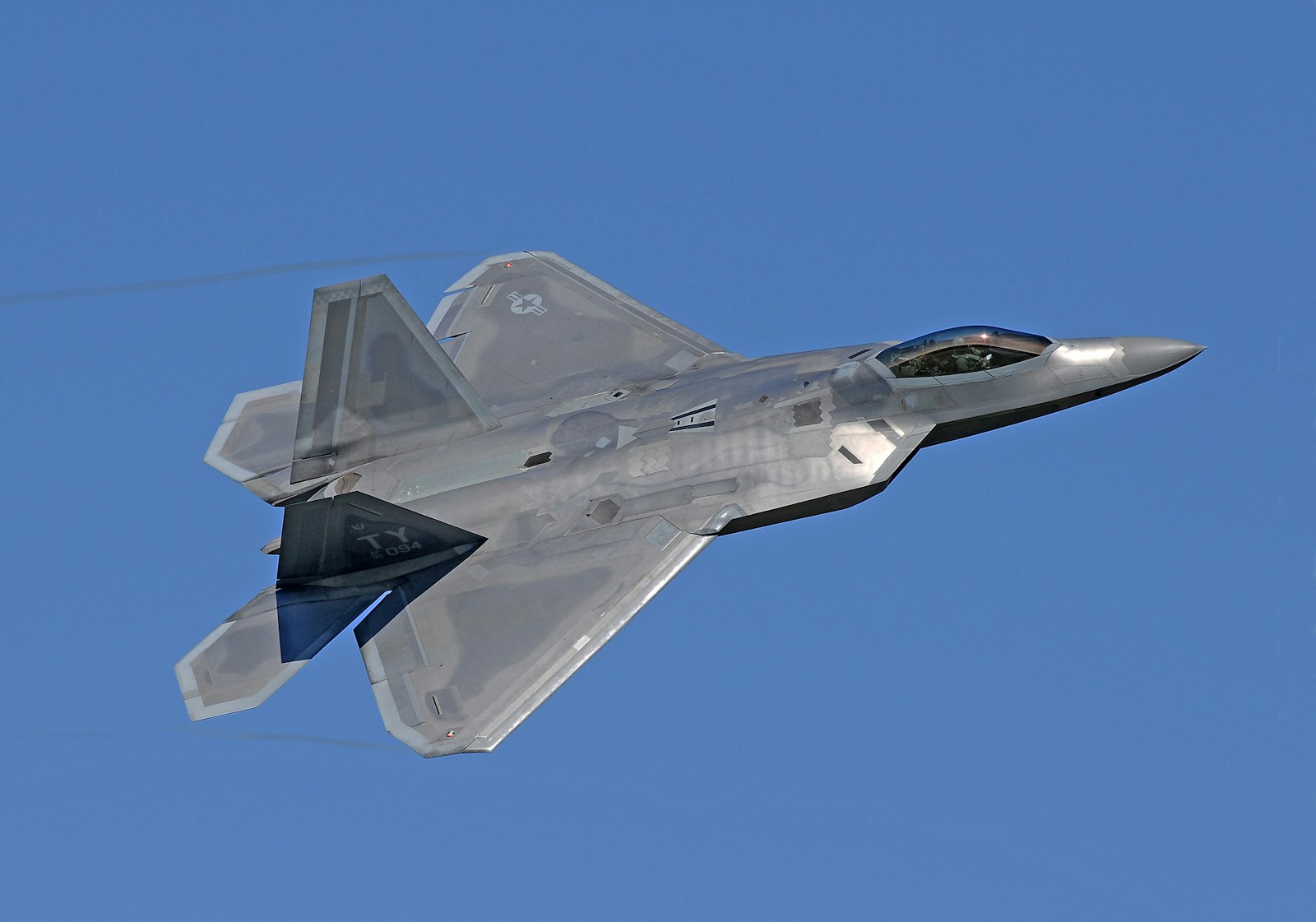 How Stealth Actually Works, and What Fifth Generation Really Means 2 An F-22 Raptor from below, showing faceted shaping and the absence of external pylons