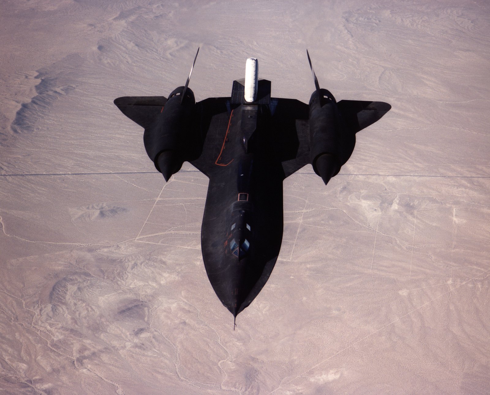Fastest Military Aircraft in the World (2026 Update) 1 Lockheed SR-71 Blackbird seen from above in flight over the Mojave desert