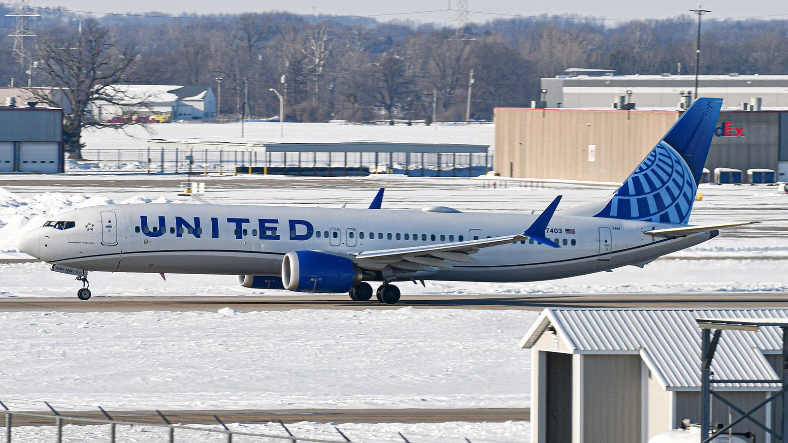 The 737 MAX 10 Is Certified: What the FAA Approved and Who Gets It First 3 A United Airlines Boeing 737 MAX 9 on the runway at Indianapolis in winter with snow on the ground