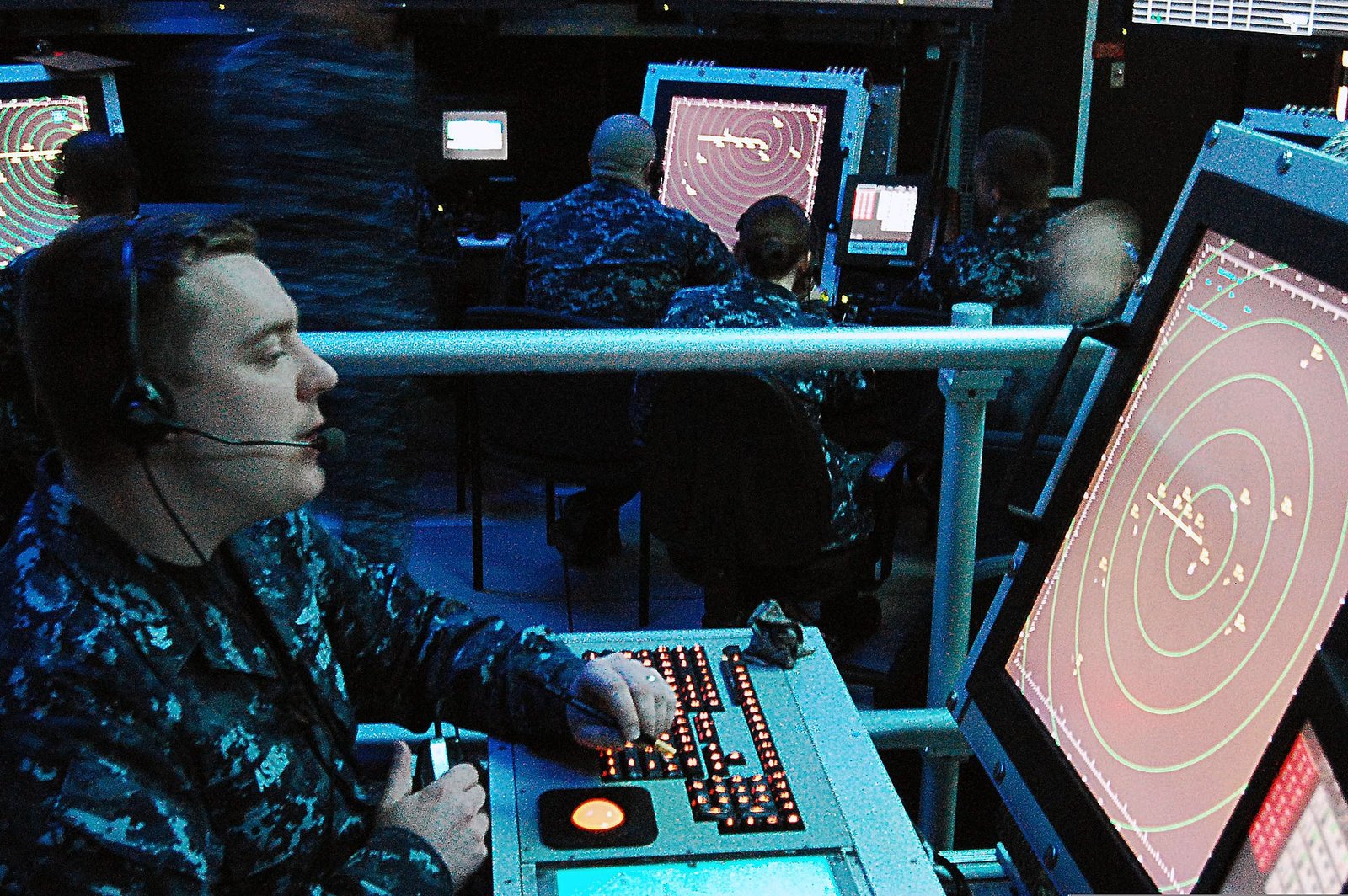 Air Traffic Controller Salary: Why the $148,080 Median Is the Least Useful Number in the Job 5 A controller working a radar scope in a darkened carrier air traffic control simulator