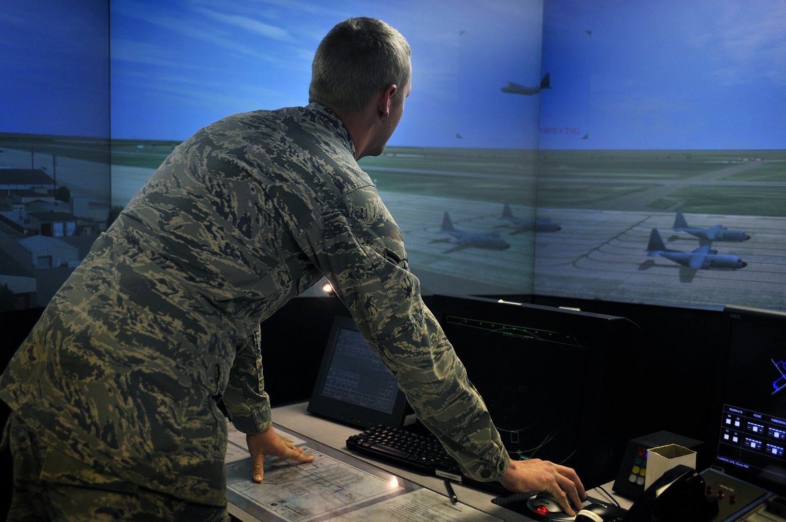 Air Traffic Controller Salary: Why the $148,080 Median Is the Least Useful Number in the Job 4 A trainee controller working a tower simulator with a wraparound screen showing aircraft on an airfield